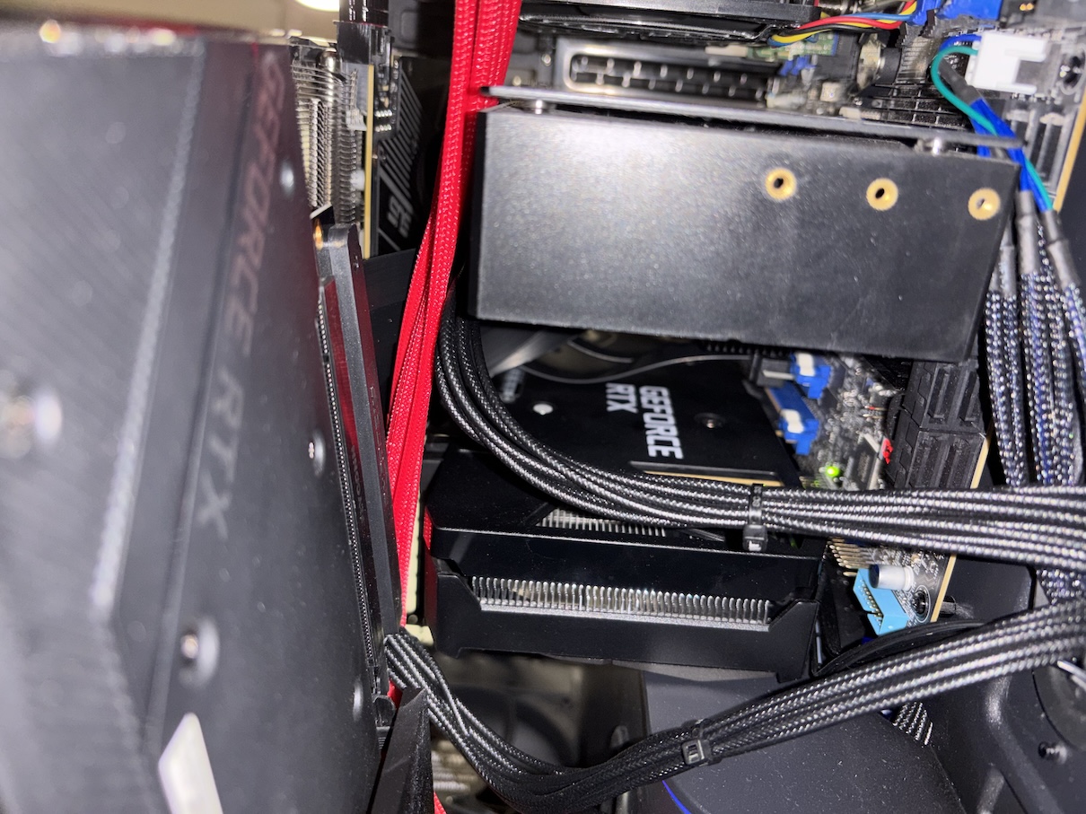 Inside the PC case, looking at two GPUs directly attached to the motherboard